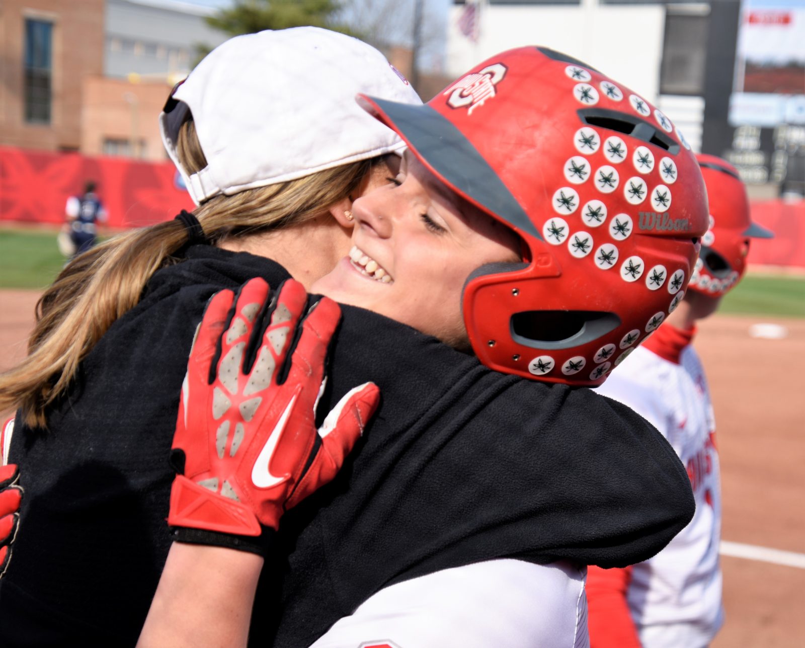 Buckeye Head Coach Kelly Kovach Schoenly gives her player Emily Clark a big hug after she